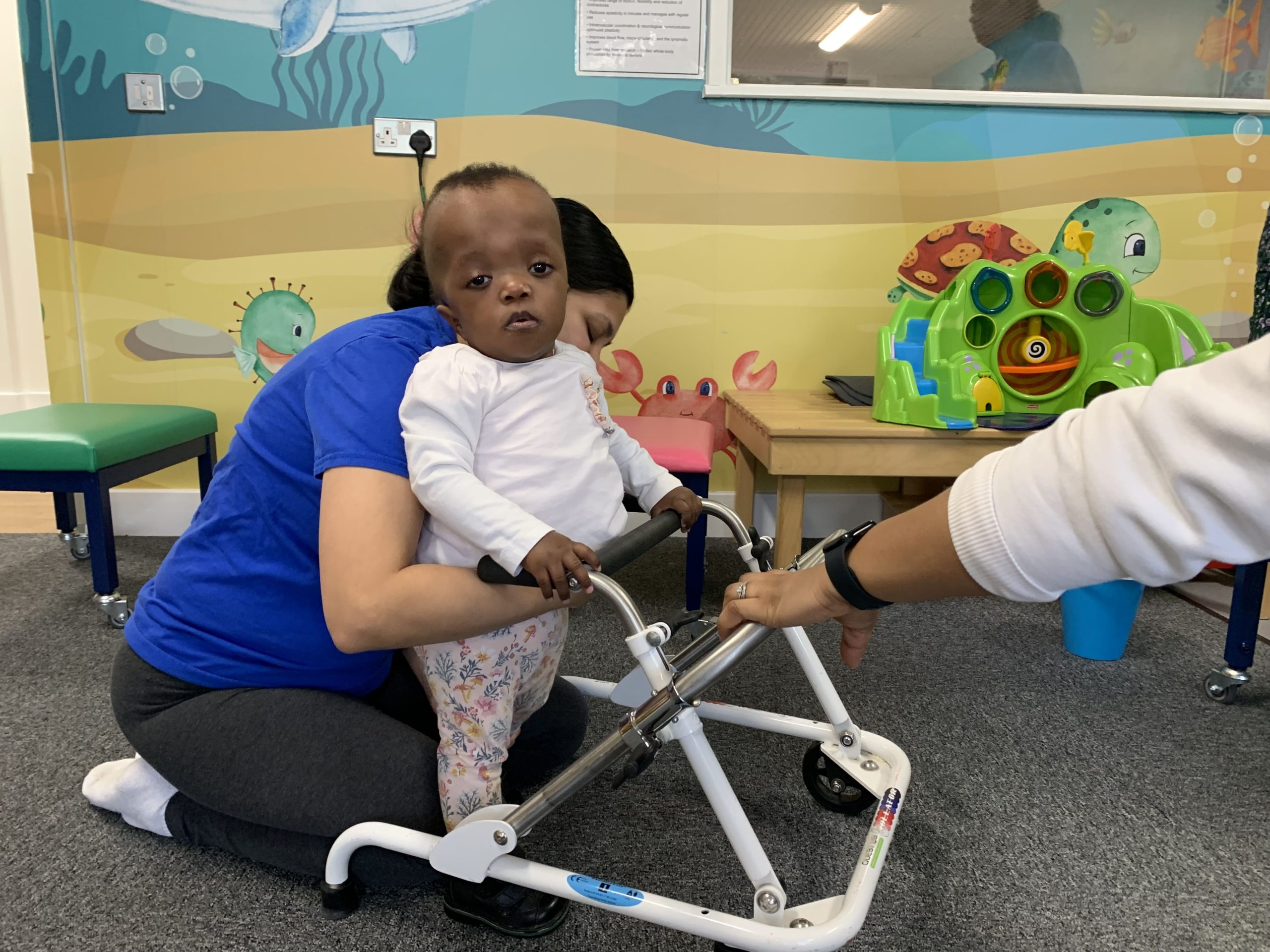 A young girl with Noonan's Syndrome in her physiotherapy session.